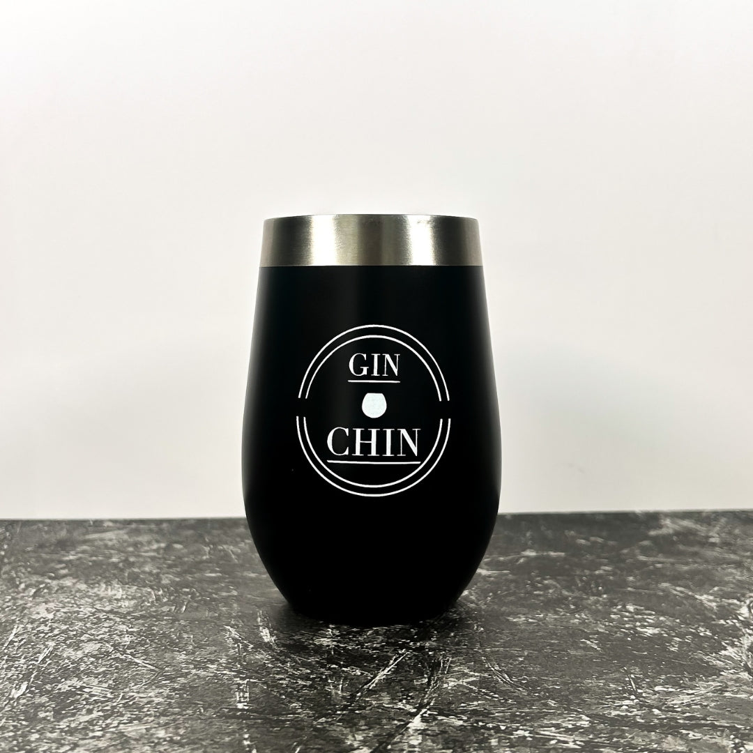 Black insulated tumbler with 'GIN CHIN' text on a grey surface