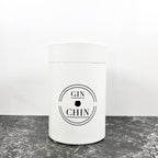 White gift box for insulated travel tumblers with 'GIN CHIN' label on a grey surface